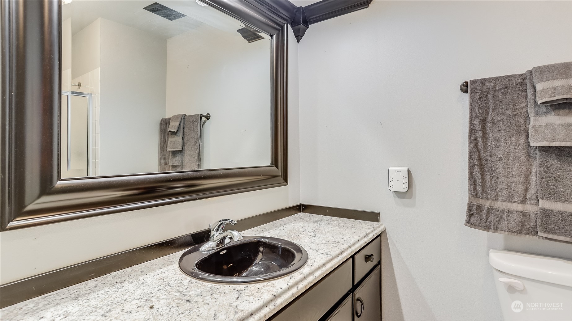 17420 147th Avenue Southeast, Unit 6 Renton, WA 98058 - Photo 28 of 32 a bathroom with a sink a toilet and a mirror