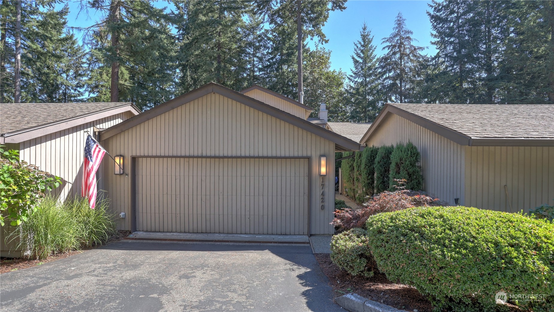 17420 147th Avenue Southeast, Unit 6 Renton, WA 98058 - Photo 5 of 32 a front view of a house with garden
