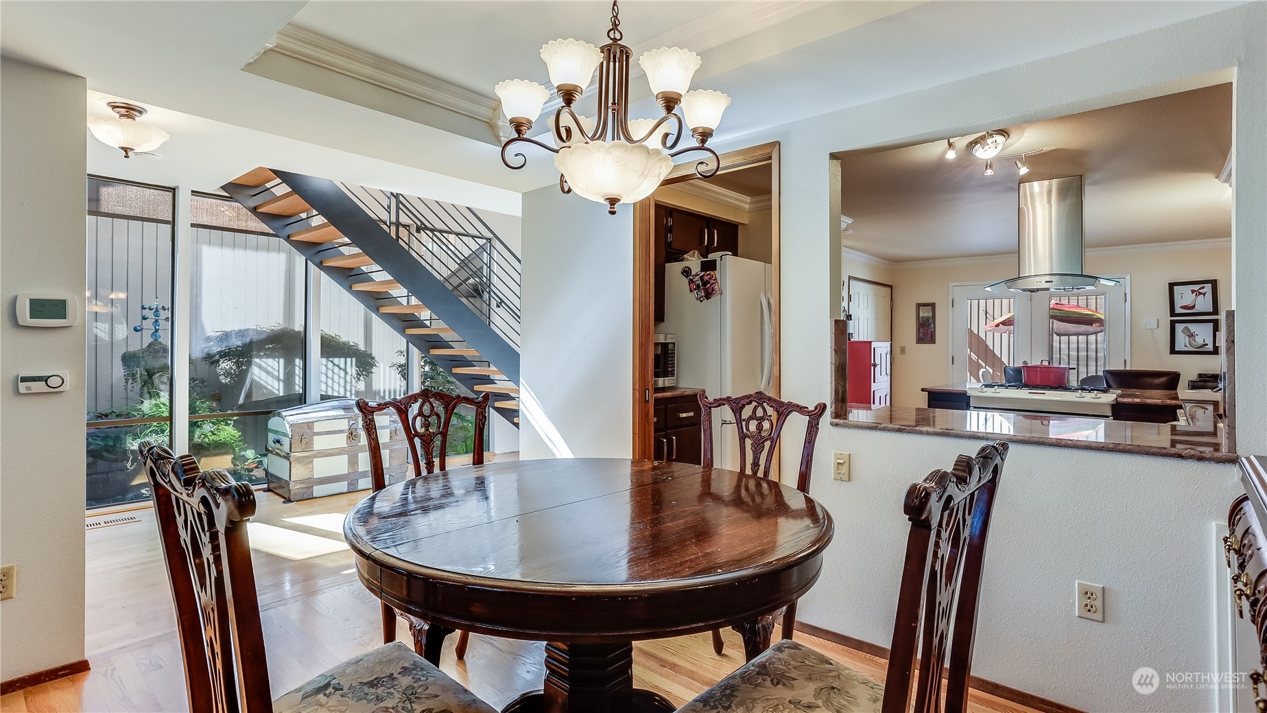 17420 147th Avenue Southeast, Unit 6 Renton, WA 98058 - Photo 10 of 32 a view of a dining room with furniture and a chandelier