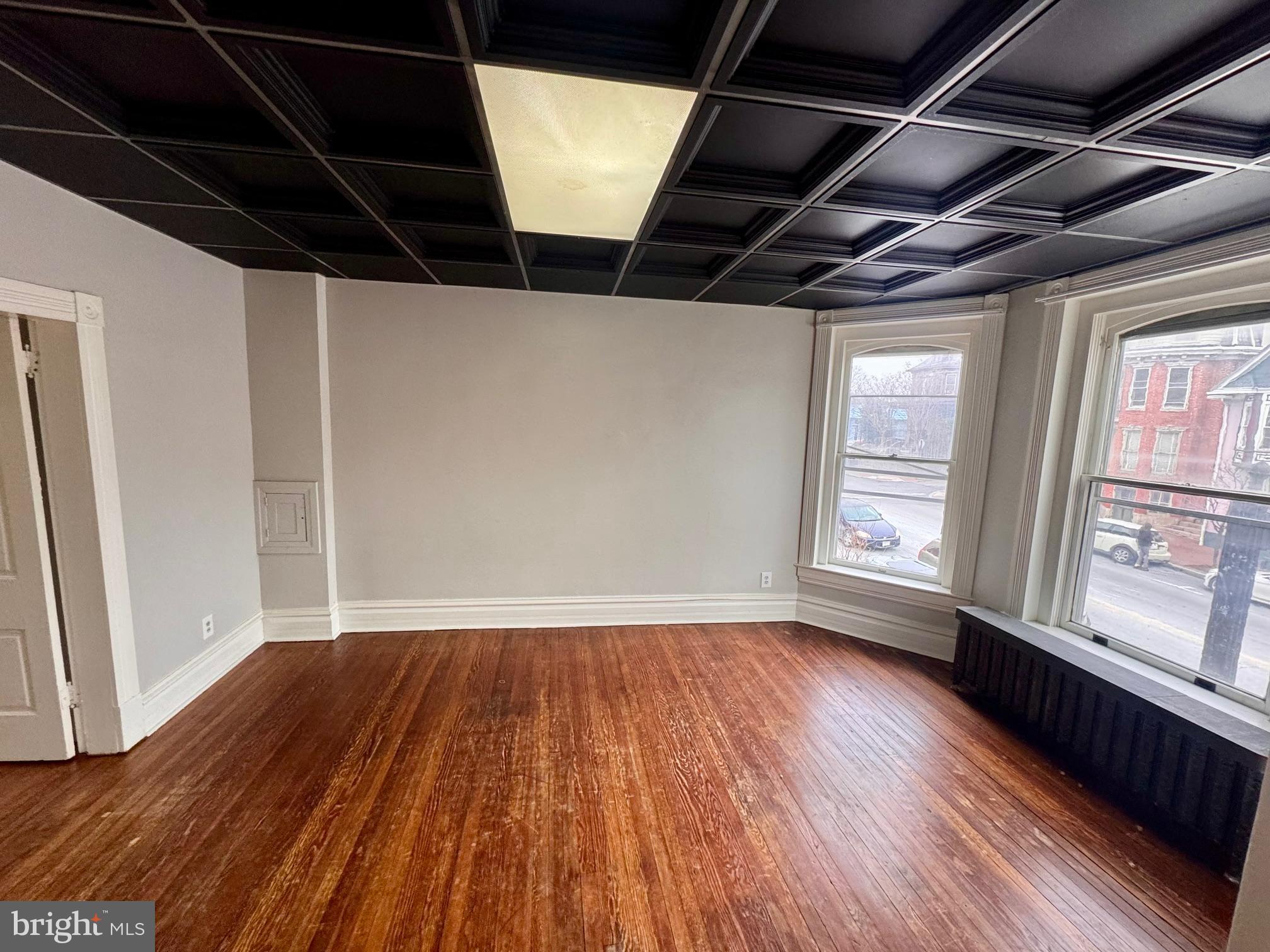 110 West Main Street Waynesboro, PA 17268 - Photo 7 of 10 a view of an empty room with wooden floor and a window