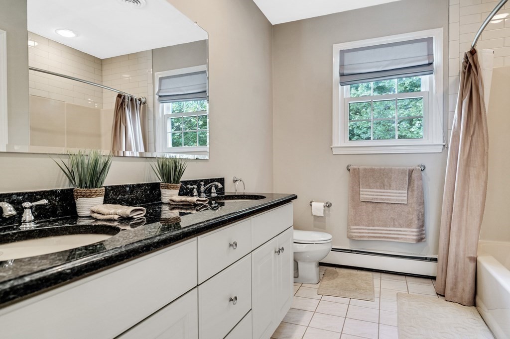 8 Liberty Road Medfield, MA 02052 - Photo 15 of 29 a kitchen with a sink stove and cabinets