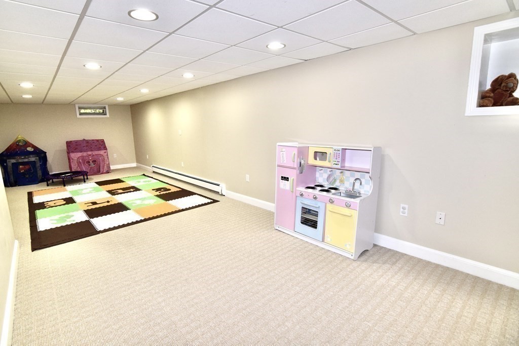 8 Liberty Road Medfield, MA 02052 - Photo 20 of 29 a kitchen that has a lot of cabinets and wooden floor