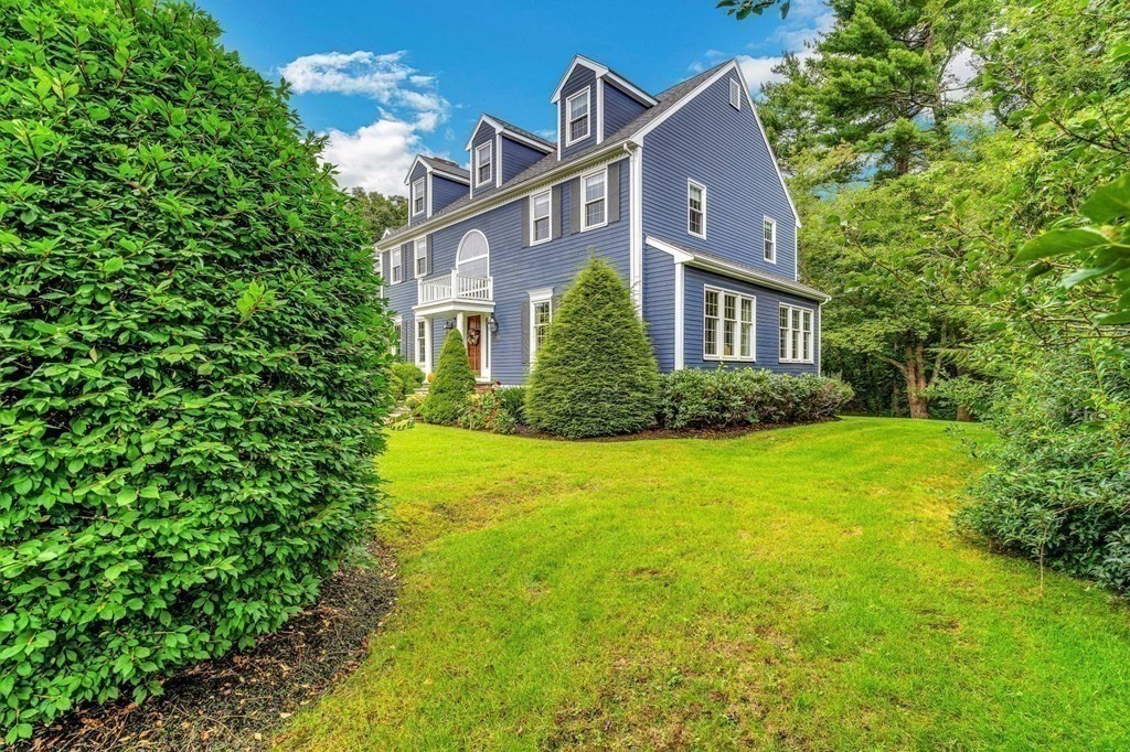 8 Liberty Road Medfield, MA 02052 - Photo 23 of 29 a front view of a house with garden