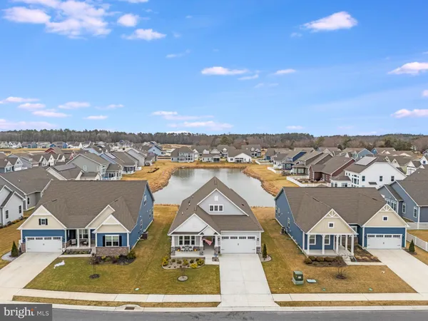 an aerial view of houses with a city
