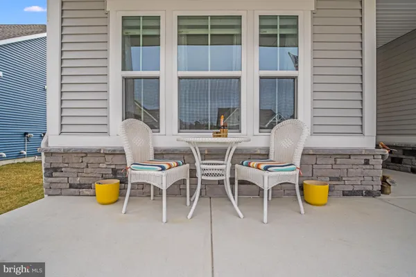 a view of a dining room with swimming pool and sitting space