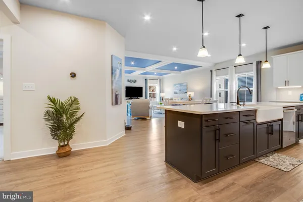 a kitchen with stainless steel appliances a sink stove and cabinets