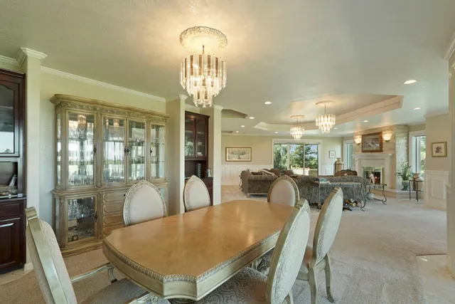 a kitchen with a sink window and cabinets