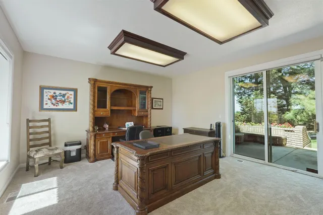 a kitchen with a sink refrigerator and cabinets
