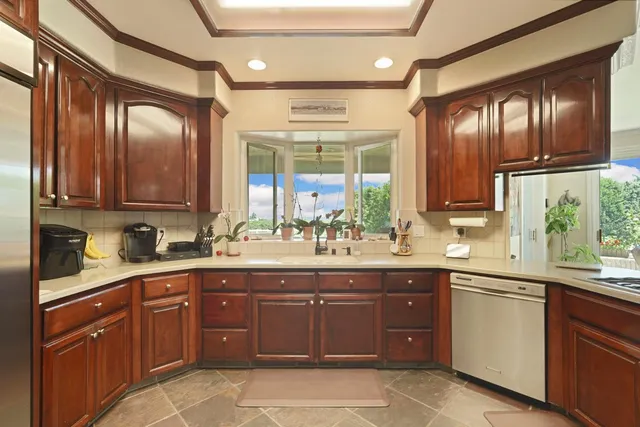 a spacious bedroom with a bed and a large window