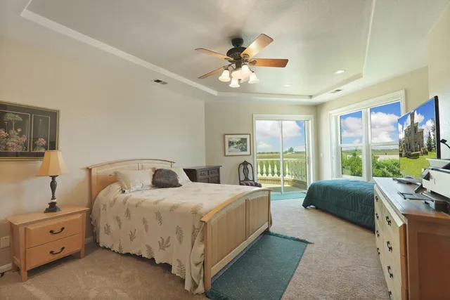 an aerial view of a house with garden space and street view