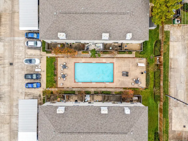 a view of a swimming pool with a lounge chairs