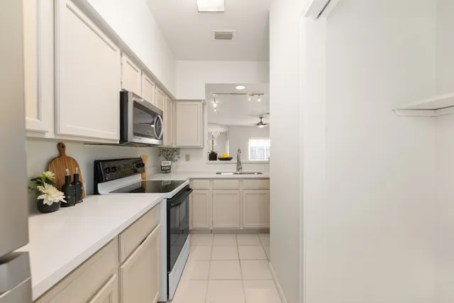 a kitchen with a sink and cabinets