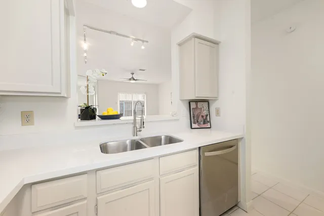 a kitchen with a sink and cabinets