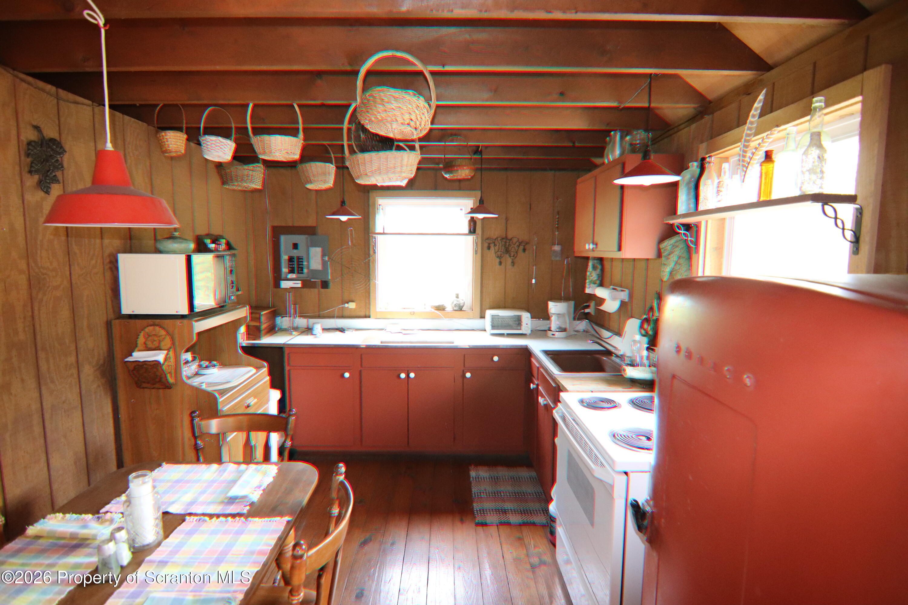 300 Pennsworth Hill Road Meshoppen, PA 18630 - Photo 27 of 38 a kitchen with wooden cabinets a sink and a stove