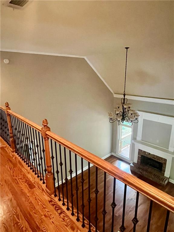 348 Hidden Trail Pendergrass, GA 30567 - Photo 31 of 40 a view of a hallway with wooden floor and a fireplace