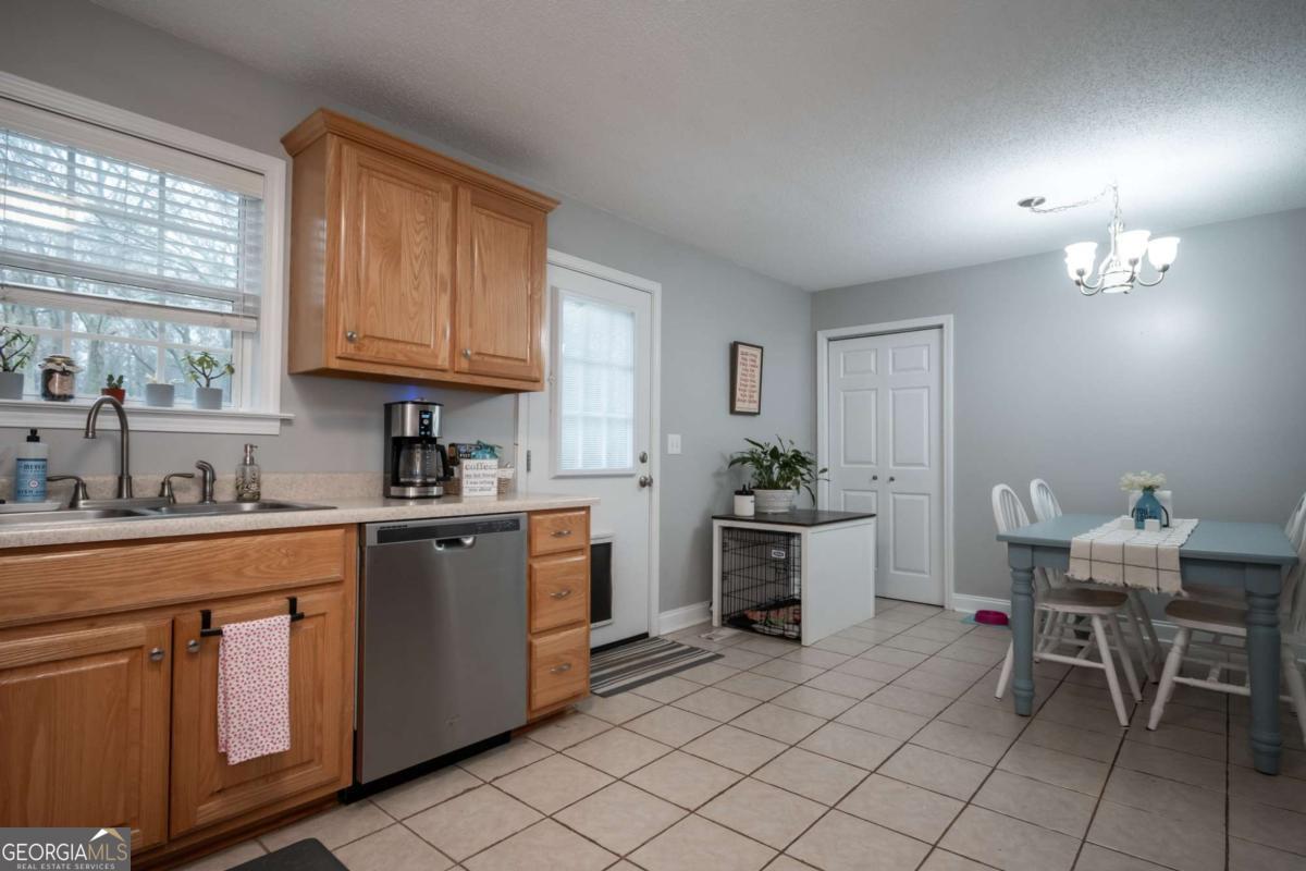 199 Brickyard Road Comer, GA 30629 - Photo 15 of 43 a kitchen with cabinets and chairs