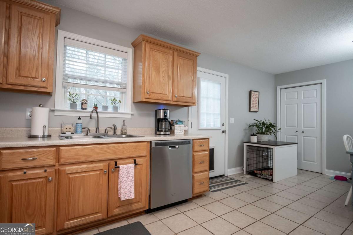 199 Brickyard Road Comer, GA 30629 - Photo 16 of 43 a kitchen with cabinets appliances and a window