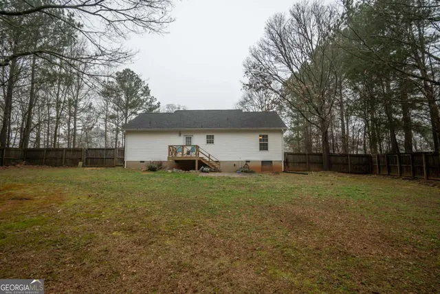 a front view of house with yard and trees