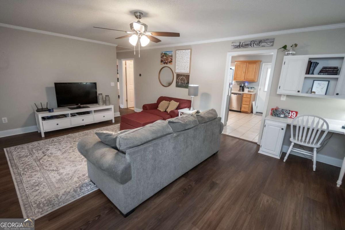 199 Brickyard Road Comer, GA 30629 - Photo 4 of 43 a living room with furniture and a flat screen tv