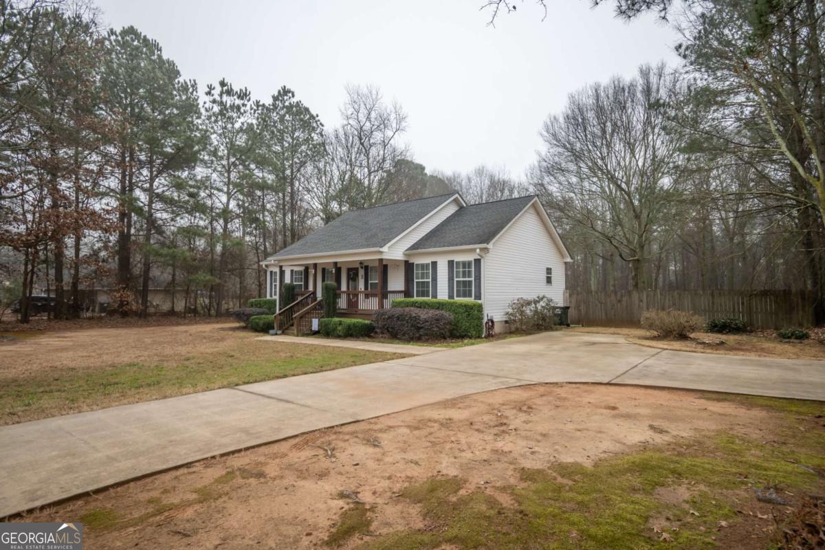 199 Brickyard Road Comer, GA 30629 - Photo 42 of 43 a front view of a house with a yard and garage