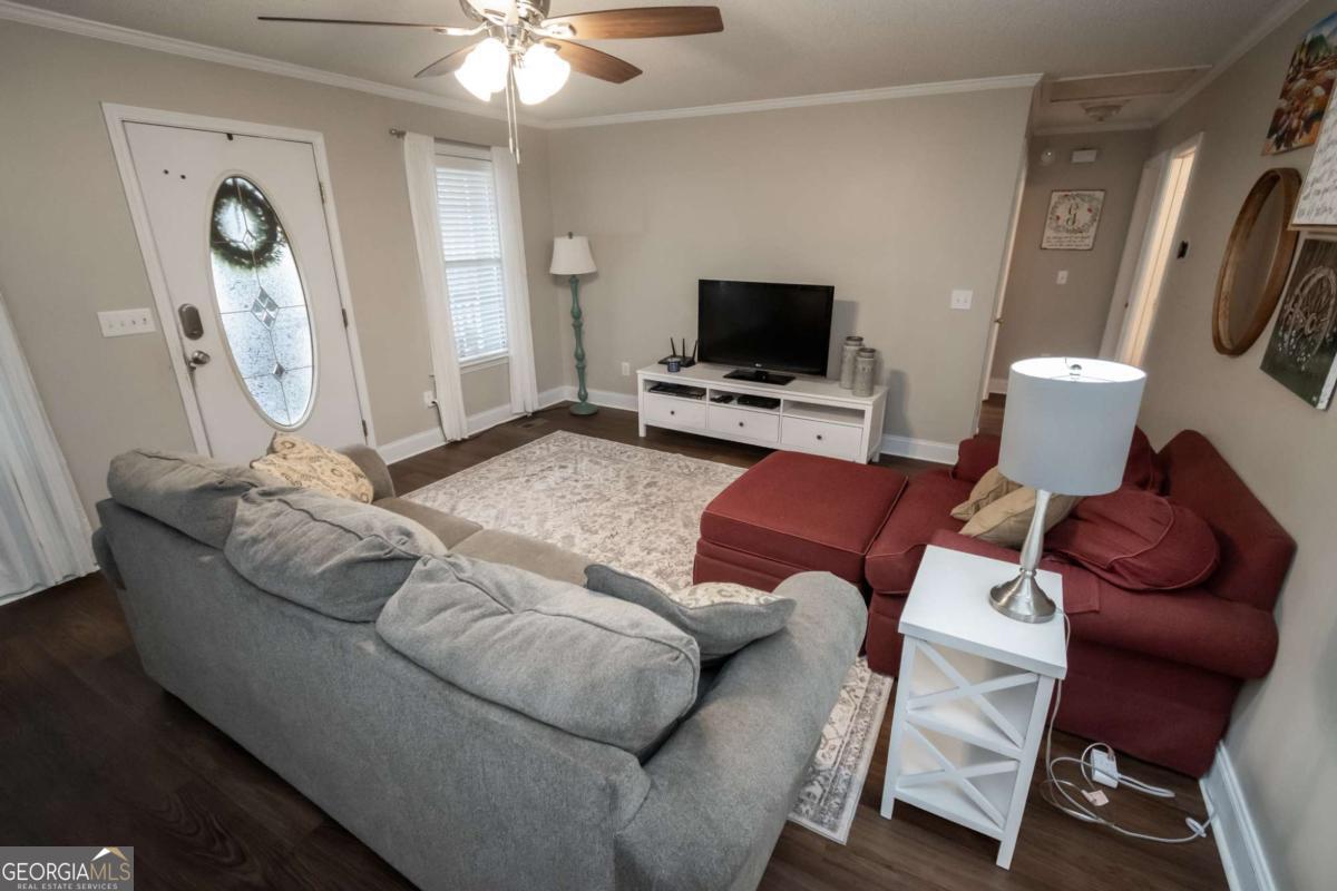 199 Brickyard Road Comer, GA 30629 - Photo 10 of 43 a living room with furniture and a flat screen tv