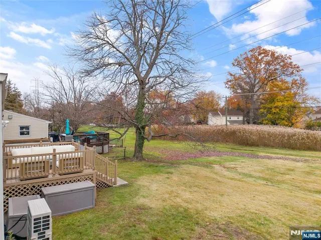 a view of a patio with a yard