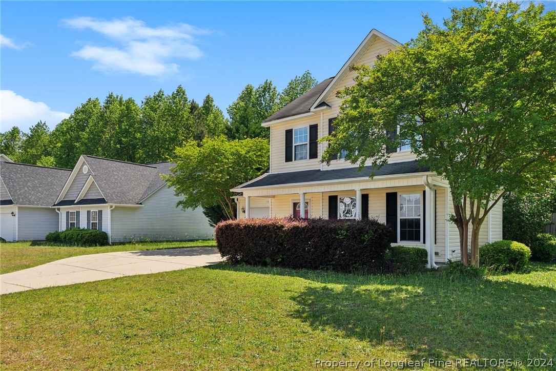 198 Cape Fear Road Raeford, NC 28376 - Photo 3 of 33 a view of a house with a big yard plants and large trees