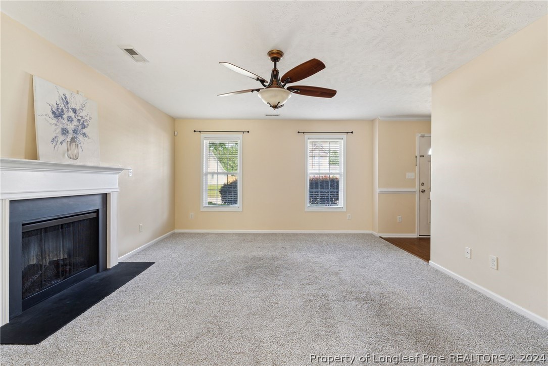 198 Cape Fear Road Raeford, NC 28376 - Photo 6 of 33 a view of an empty room with a fireplace