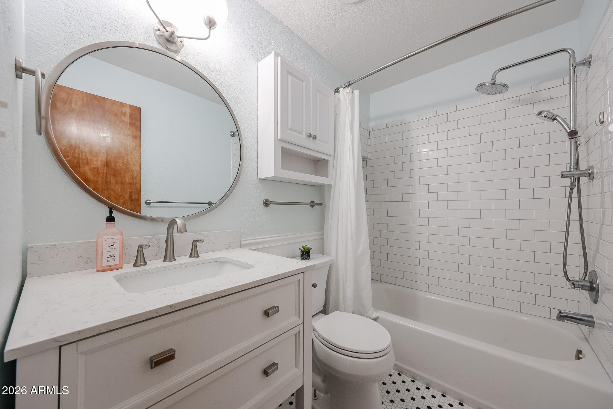 5114 East Monte Vista Road Phoenix, AZ 85008 - Photo 28 of 45 a bathroom with a sink a toilet and a mirror