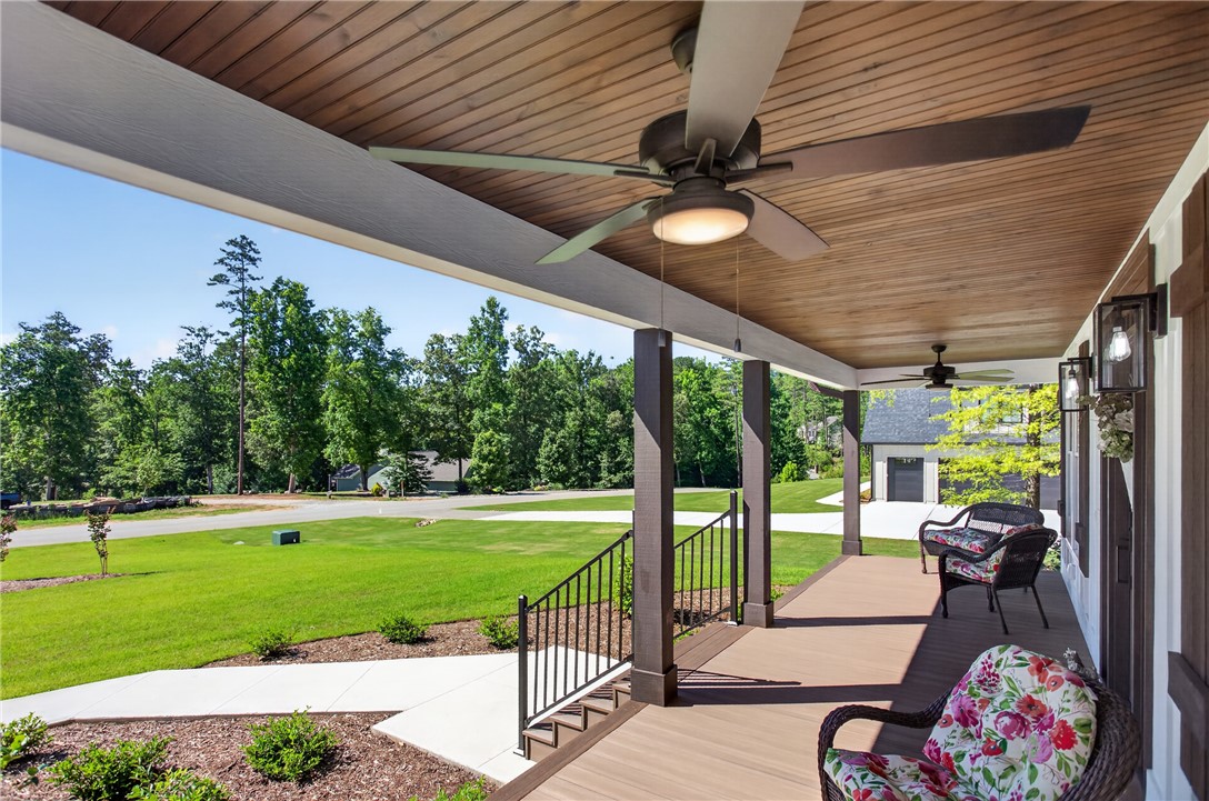 921 Falling Waters Lane Seneca, SC 29672 - Photo 3 of 46 Relax on this grand covered porch, offering expansive views of the landscaped property.