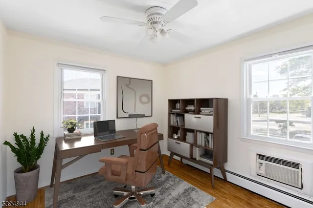 a work room with furniture and a window