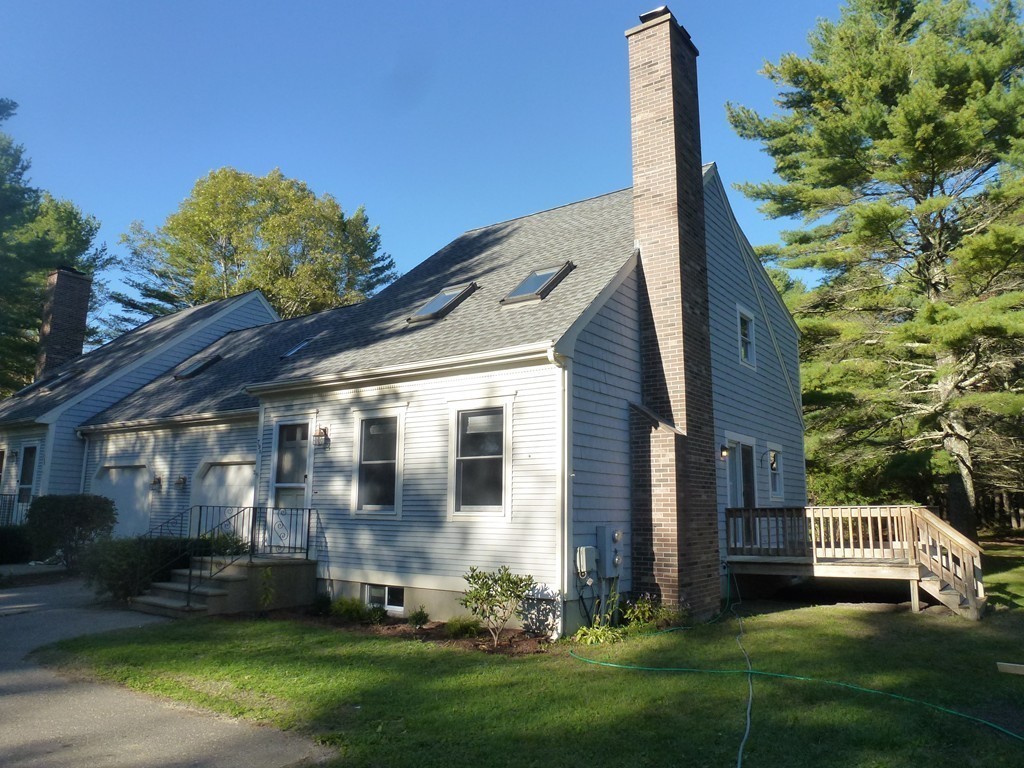 79 Papermill Road, Unit A Wareham, MA 02576 - Photo 1 of 28 a view of a house with a yard and plants