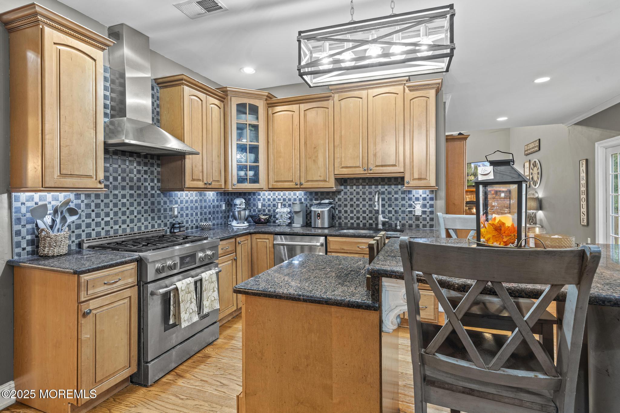 33 Harbor Road Morganville, NJ 07751 - Photo 15 of 49 a kitchen with granite countertop a sink a counter top space and cabinets