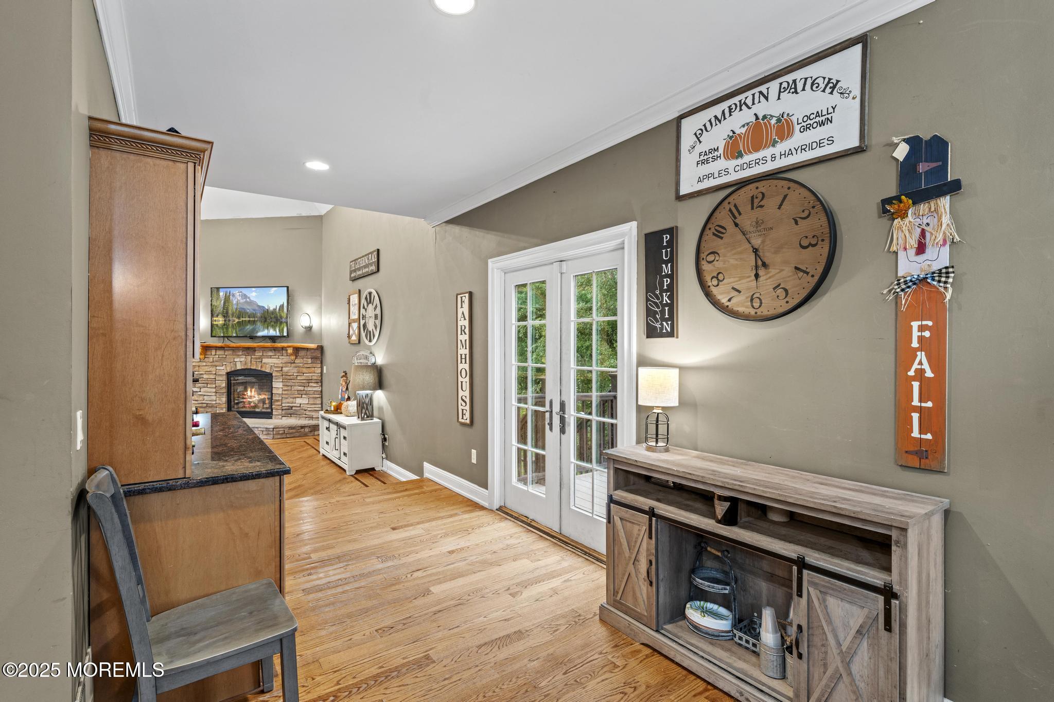 33 Harbor Road Morganville, NJ 07751 - Photo 19 of 49 a living room with furniture a clock and a window