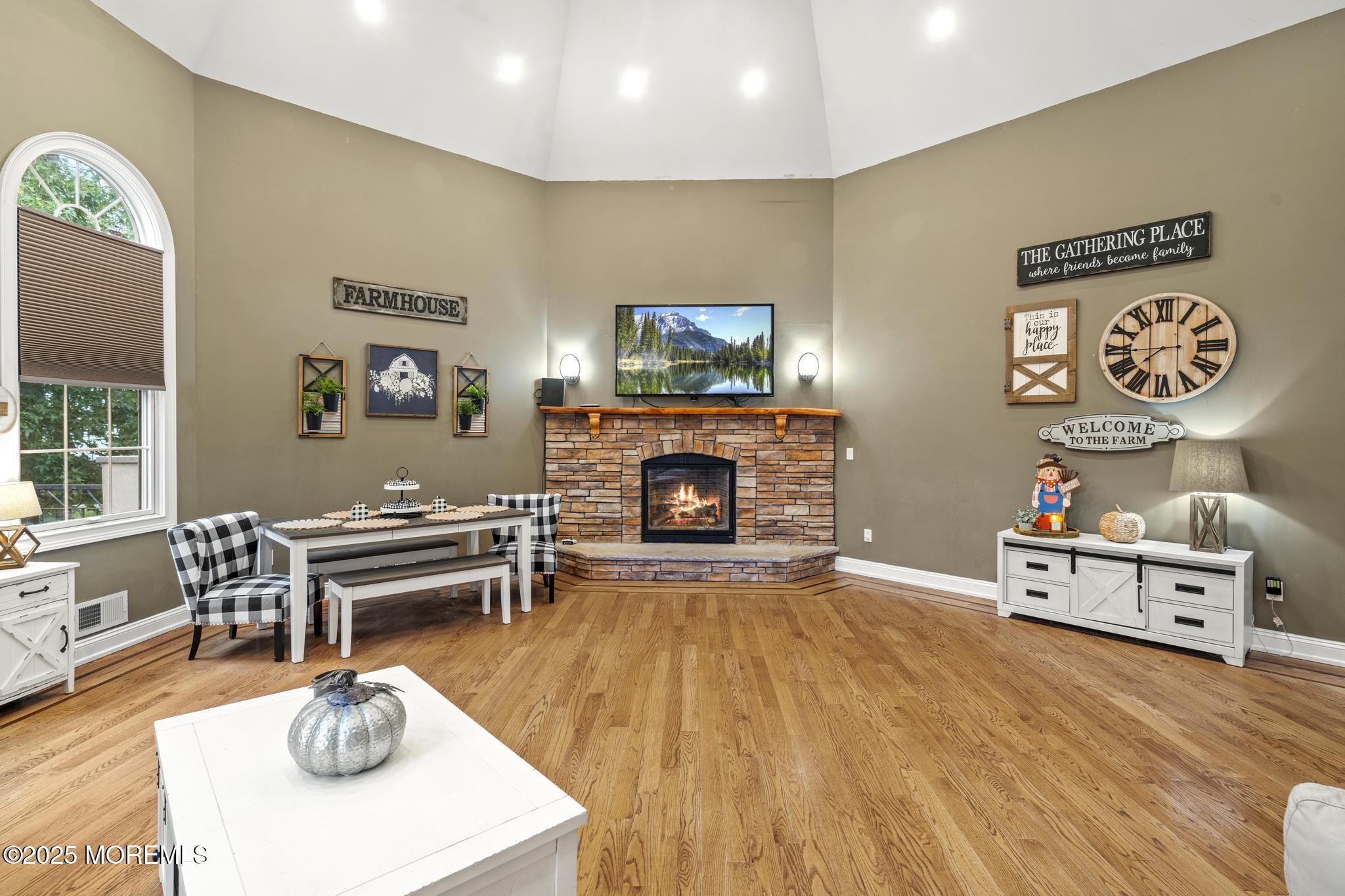 33 Harbor Road Morganville, NJ 07751 - Photo 20 of 49 a living room with furniture and a fireplace