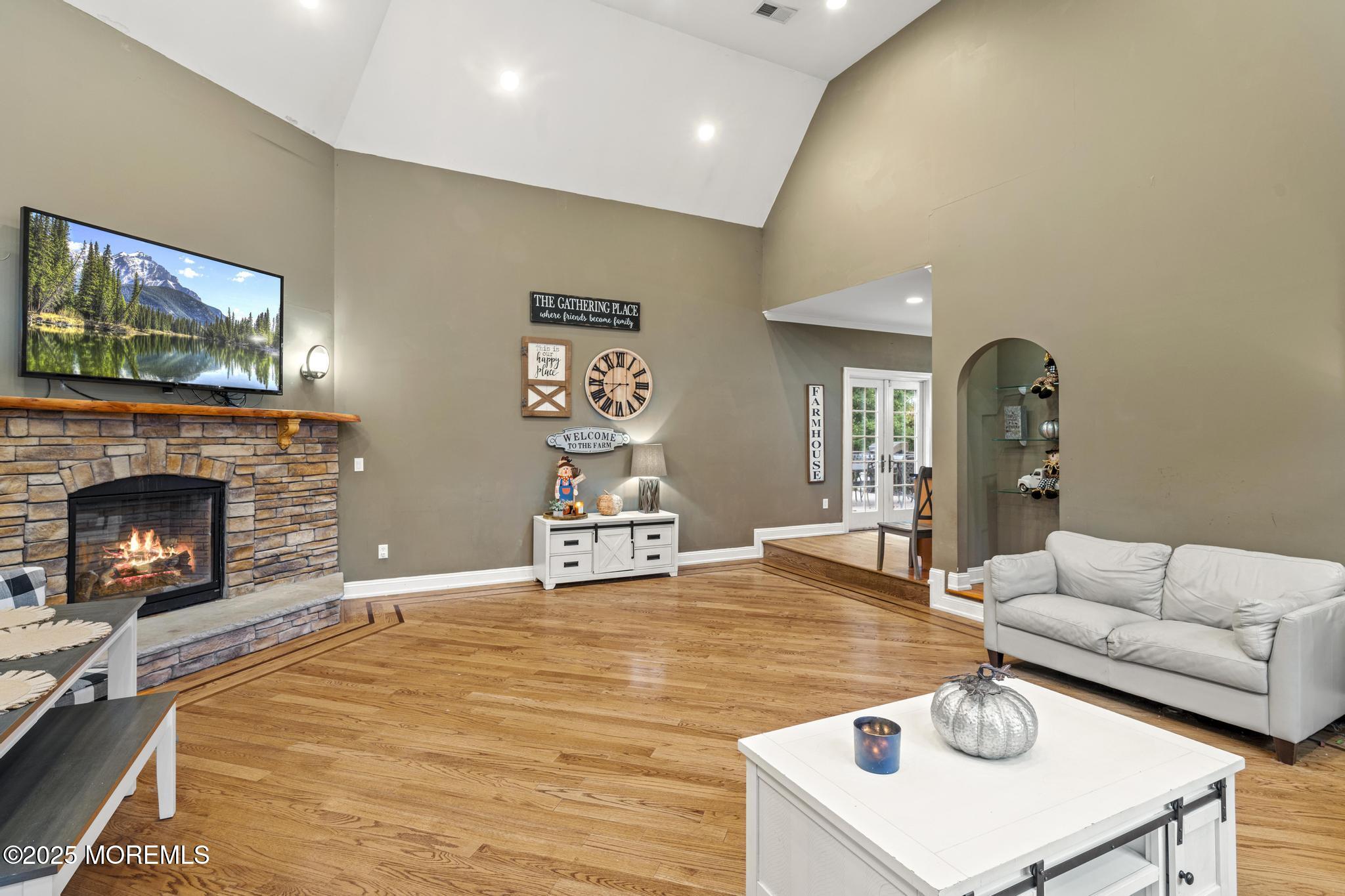 33 Harbor Road Morganville, NJ 07751 - Photo 22 of 49 a living room with furniture and a fireplace