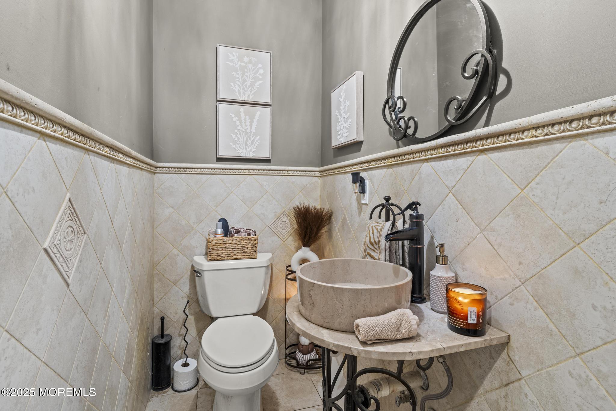 33 Harbor Road Morganville, NJ 07751 - Photo 23 of 49 a bathroom with a toilet and a sink