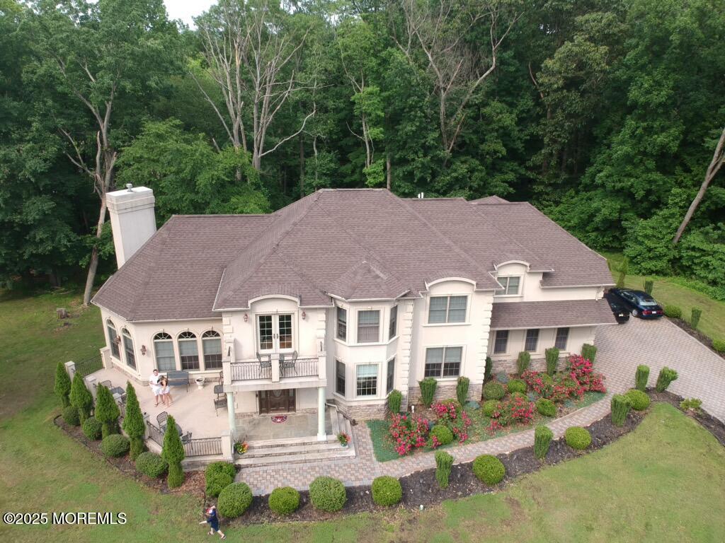 33 Harbor Road Morganville, NJ 07751 - Photo 3 of 49 front view of a house with a garden
