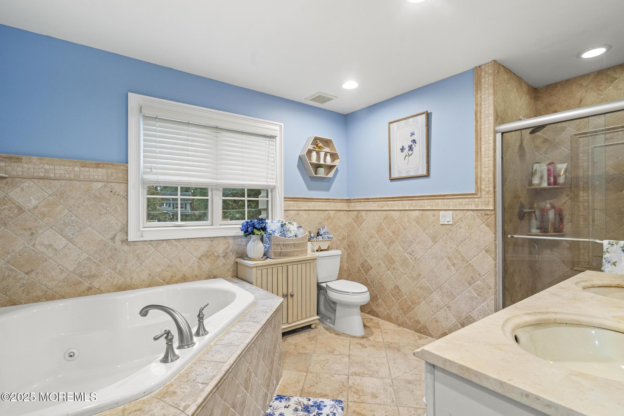 33 Harbor Road Morganville, NJ 07751 - Photo 31 of 49 a bathroom with a granite countertop bathtub sink and toilet