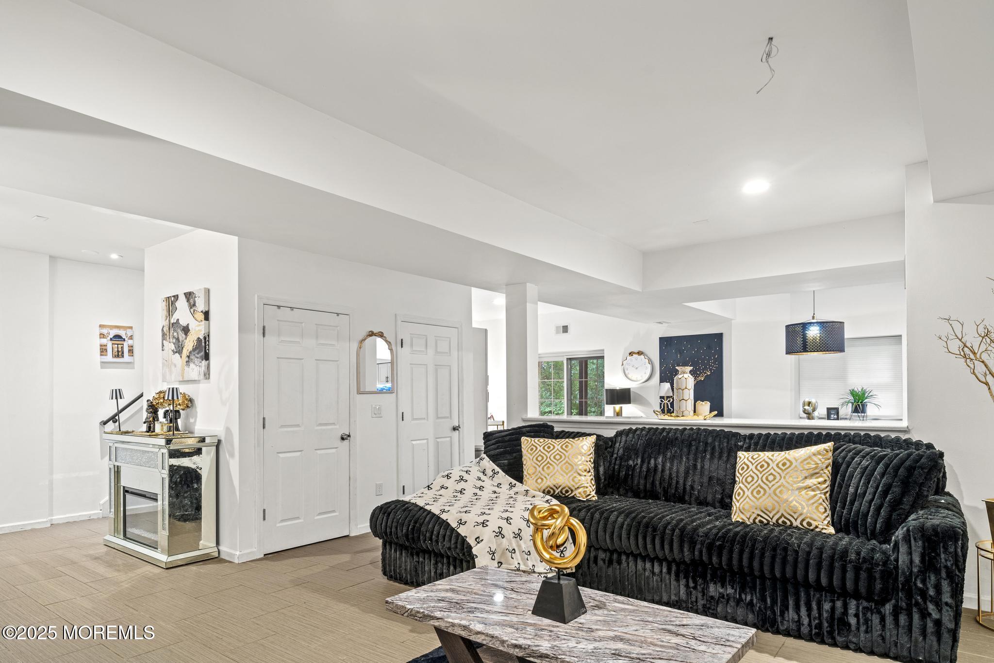 33 Harbor Road Morganville, NJ 07751 - Photo 40 of 49 a living room with furniture and a large window