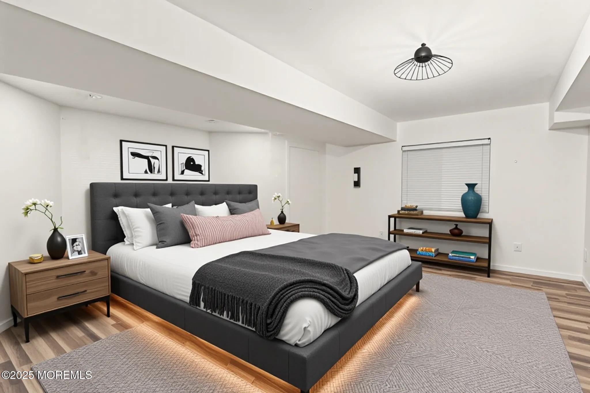 33 Harbor Road Morganville, NJ 07751 - Photo 45 of 49 a bedroom with a bed and a chandelier