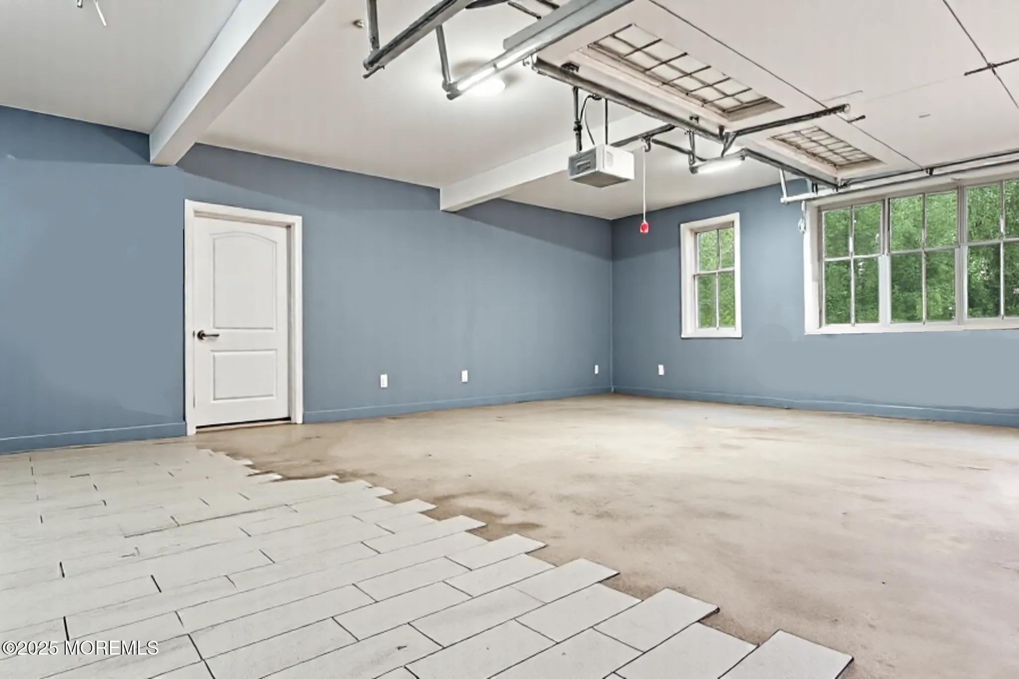 33 Harbor Road Morganville, NJ 07751 - Photo 47 of 49 an empty room with windows and ceiling fan