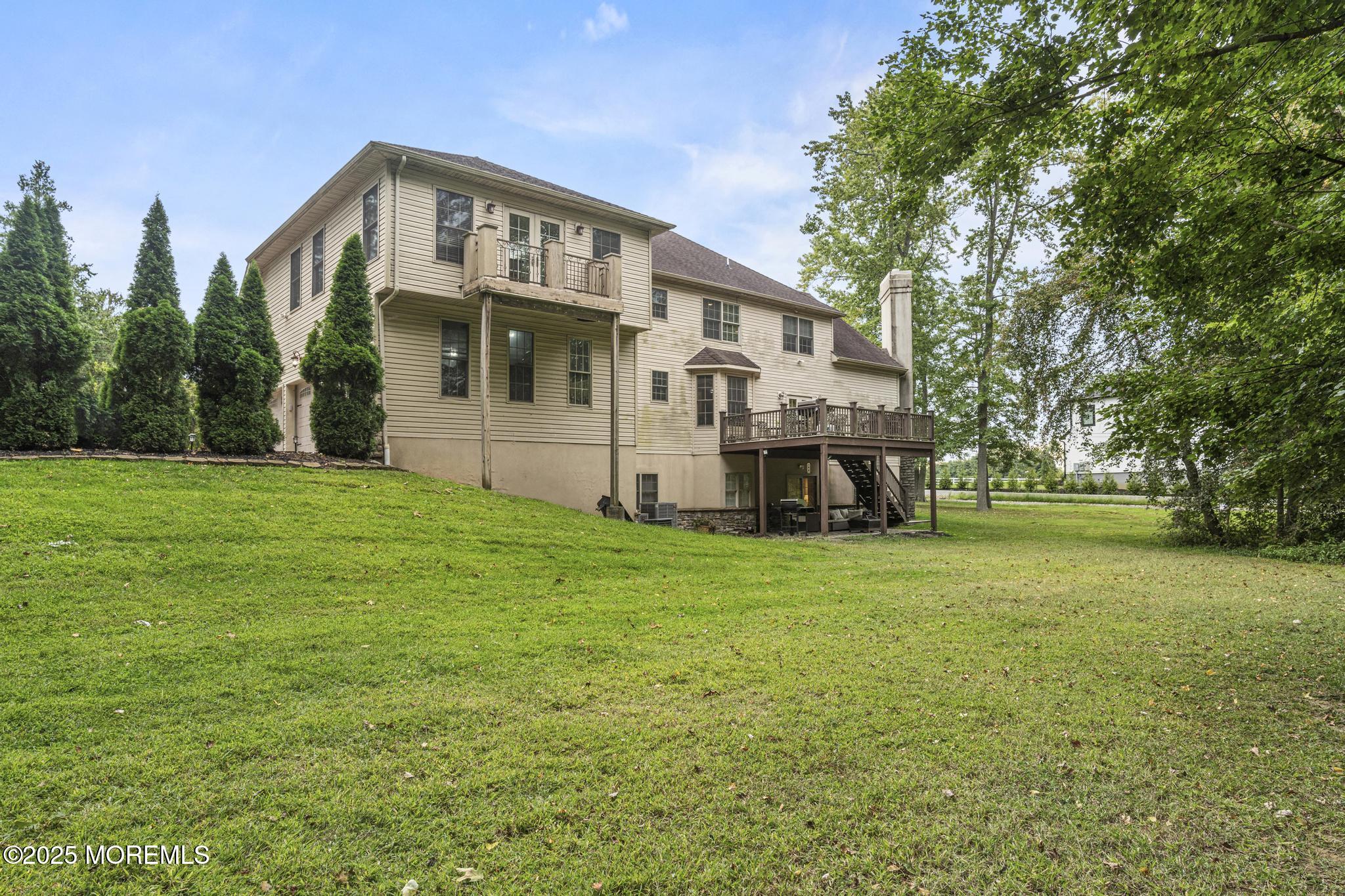 33 Harbor Road Morganville, NJ 07751 - Photo 48 of 49 a front view of a house with a garden