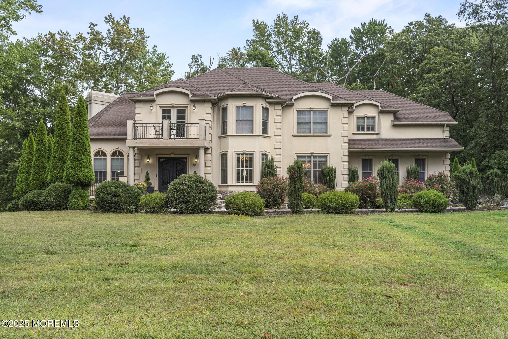 33 Harbor Road Morganville, NJ 07751 - Photo 49 of 49 a front view of a house with a garden