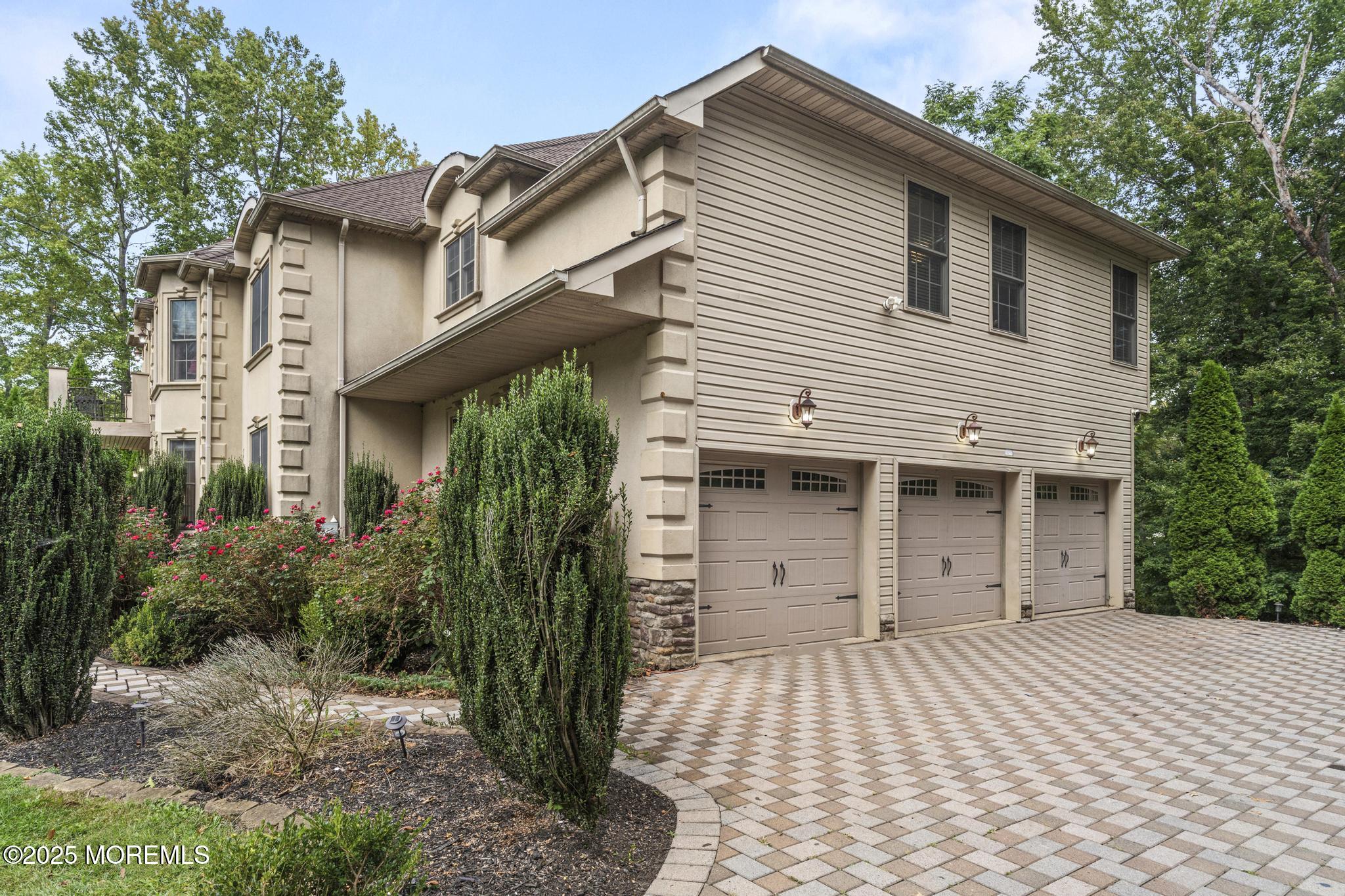 33 Harbor Road Morganville, NJ 07751 - Photo 5 of 49 a front view of a house with a garden