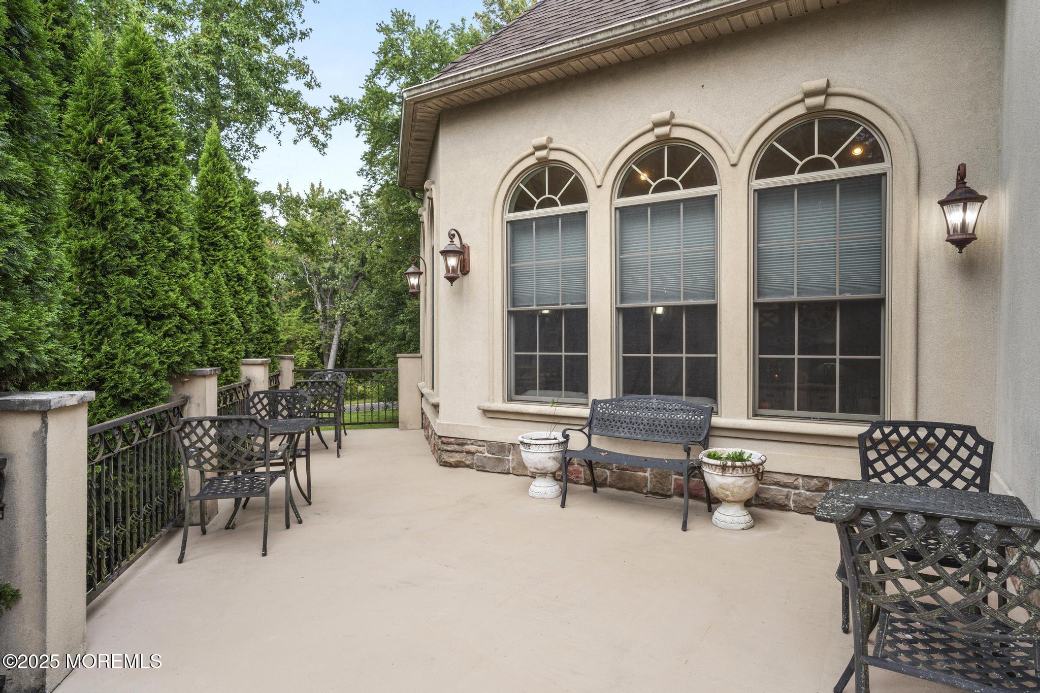 33 Harbor Road Morganville, NJ 07751 - Photo 7 of 49 a front view of a house with outdoor seating
