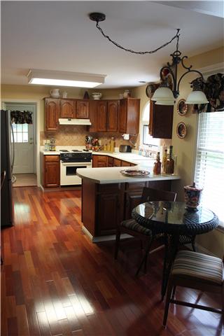 807 Hickory Ridge Trail Columbia, TN 38401 - Photo 5 of 17 Kitchen is spacious with eat in area and gorgeous cherry floors.