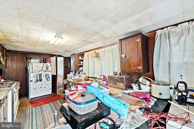 a room with musical instrument pool table and windows