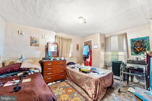 a bed room with furniture and a window