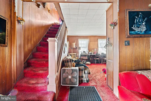 a view of living room with furniture and a rug